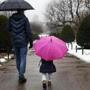 Olivia Sodhi of Boston and her dad, Karan, walked through the rain underneath umbrellas in the Public Garden on Sunday. 