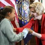 Senator Elizabeth Warren greeted Ellie Zink, 9, of Franklin, N.H., after a campaign appearance.