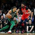 BOSTON, MA - DECEMBER 10: Jayson Tatum #0 of the Boston Celtics drives against Anthony Davis #23 of the New Orleans Pelicans at TD Garden on December 10, 2018 in Boston, Massachusetts. (Photo by Maddie Meyer/Getty Images)
