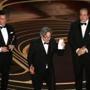 From left, Brian Currie, Peter Farrelly, and Nick Vallelonga accept the original screenplay Oscar for ?Green Book.?