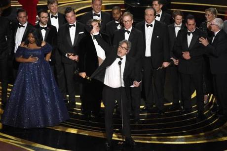 Peter Farrelly (center) and the cast and crew of ?Green Book? accept the award for best picture at the Oscars on Sunday.
