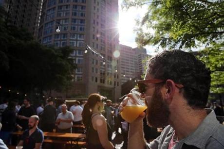 Boston, MA- June 01, 2017: Derek Swart enjoys a Little Chicken pale ale while visiting Trillium Garden on the Greenway in Boston, MA on June 01, 2017. 2014. The cult favorite among beer drinkers ? opened its outdoor beer garden on Boston?s Rose Kennedy Greenway Thursday. The seasonal open-air beer garden, which will run weekly through October, is free to get into, with draft beer from Trillium and wine from Westport Rivers Winery available for purchase. (Globe staff photo / Craig F. Walker) section: metro reporter:
