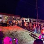 First responders worked the scene of a collision involving a Manhattan-bound commuter train and a vehicle in Westbury, New York, Tuesday.  