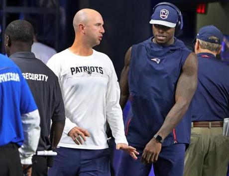 Detroit, MI: 9-23-18: Before the game, Patriots wide reciever Josh Gordon (right) spent time on the field with Jack Easterby, (left) the organization's character coach/team chaplin. The New England Patriots visited the Detroit Lions in a regular season Sunday Night NFL football game at Ford Field. (Jim Davis/Globe Staff)

