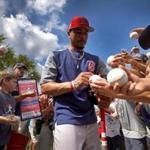 Fort Myers , FL - 2/18/2019 - (Day 7) Boston Red Sox center fielder Mookie Betts (50) signs for fans during the first full squad workout at Jet Blue Park in Fort Myers, FL. - (Barry Chin/Globe Staff), Section: Sports, Reporter: Peter Abraham, Topic: 18Red Sox, LOID: 8.5.44661335.