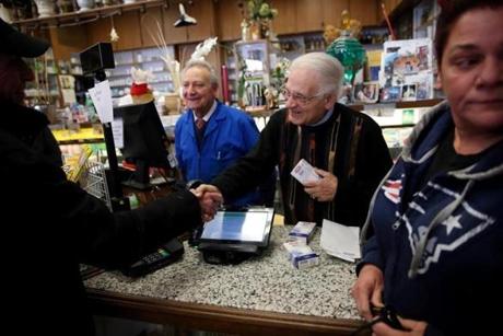 Freddy (left) and Peppi Giangregorio greeted well-wishers at the Green Cross Pharmacy in the North End.
