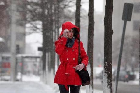 Snow was falling in Boston on Saturday morning, and the pedestrians that were out and about were bundled up.
