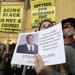 Anita Ross held a photo of shooting victim Stephon Clark. The police officers who shot Clark, a vandalism suspect, have said they thought he had a gun but investigators found only a cellphone.