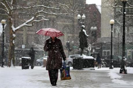 Charlotte Simpson of Boston passed through Copley Square during Saturday?s snowstorm.
