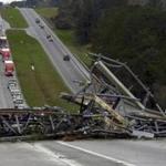 A fallen cell tower across US Route 280 highway in Lee County, Ala., after what appeared to be a tornado struck in the area Sunday. 