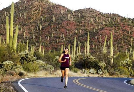 Tucson, AZ-- Jan. 17, 2018-Stan Grossfeld/ Globe Staff--Sarah Sellers, who finished a surprise second place in the women's category of the 2018 Boston Marathon, Here she runs in Sagauro National Park.
