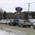 Area law enforcement vehicles gathered near the scene of a shooting in Rockford, Ill., Thursday. 