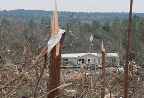 TOPSHOT - Damage is seen from a tornado which killed at least 23 people in Beauregard, Alabama on March 4, 2019. - Rescuers in Alabama were set to resume search operations Monday after at least two tornadoes killed 23 people, uprooted trees and caused 