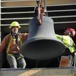 Workers remove the historic ?Thomas Mears Bell? from the Park Street Church in Downtown Boston. 
