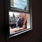 Shawn Young, who teaches home improvement classes at Keefe Tech, installed a window recently in a Waltham home. 