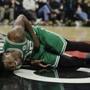 Boston Celtics' Marcus Smart reacts after colliding with Los Angeles Clippers' Montrezl Harrell during the first half of an NBA basketball game Monday, March 11, 2019, in Los Angeles. (AP Photo/Jae C. Hong)