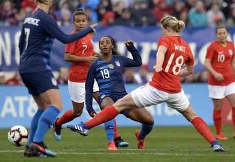 United States defender Crystal Dunn (19) passes the ball against England during the first half of a SheBelieves Cup women's soccer match Saturday, March 2, 2019, in Nashville, Tenn. (AP Photo/Mark Zaleski)
