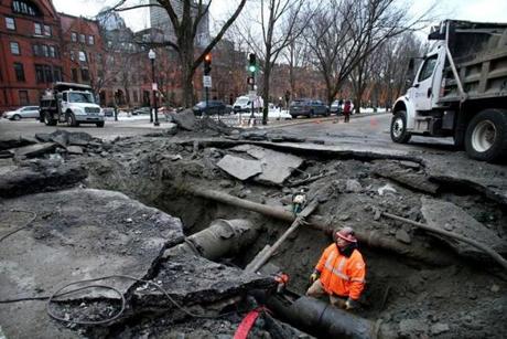  A crew works to repair a water main break at the intersection of Commonwealth Avenue and Exeter Street in Boston on Tuesday. 
