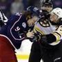 Columbus Blue Jackets forward Artemi Panarin, left, of Russia, and Boston Bruins defenseman Charlie McAvoy fight during the second period of an NHL hockey game in Columbus, Ohio, Tuesday, March 12, 2019. (AP Photo/Paul Vernon)