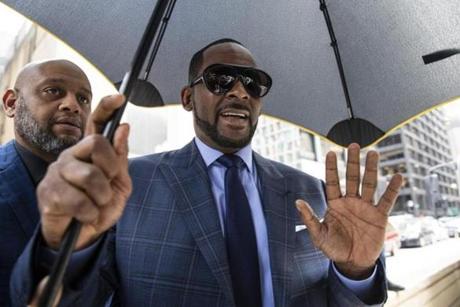 Musician R. Kelly arrives at the Daley Center for a hearing in his child support case at the Daley Center, Wednesday, March 6, 2019, in Chicago. Kelly was charged last month with sexually abusing four females dating back to 1998, including three underage girls. He's pleaded not guilty. (Ashlee Rezin/Chicago Sun-Times via AP)
