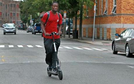 A man rode a Bird Scooter on Pearl Street in Somerville last year.  
