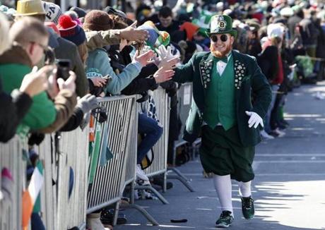 Matt Casey, who goes by Casey the Leprechaun, high fived people along the annual St. Patrick's Day parade route in 2018.
