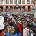 Hundreds of area students rallied at the State House on Friday to demand tough action to combat climate change before it?s too late.