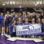 Worcester, MA--03/16/2019--The Braintree girl's basketball teams poses with the championship banner and trophy after defeating Springfield Central in the MIAA D1 girl's basketball final in Worcester on Saturday afternoon. (Nathan Klima for The Boston Globe) Topic: 17schholycross Reporter: