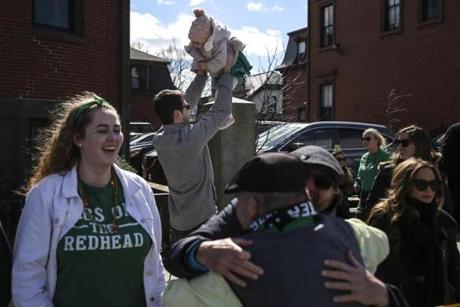 Boston, MA--03/17/2019--Steve Marsters holds his 16-month-old daughter, Madelyn, during the St, Patricks Day parade in South Boston on Sunday afternoon. (Nathan Klima for The Boston Globe) Topic: 18parade Reporter:
