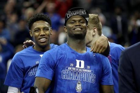 CHARLOTTE, NORTH CAROLINA - MARCH 16: Teammates RJ Barrett #5 and Zion Williamson #1 of the Duke Blue Devils react after defeating the Florida State Seminoles 73-63 in the championship game of the 2019 Men's ACC Basketball Tournament at Spectrum Center on March 16, 2019 in Charlotte, North Carolina. (Photo by Streeter Lecka/Getty Images)

