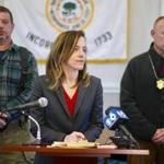 District Attorney Andrea Harrington, center, speaks during a news conference Wednesday, March 13, 2019, at Sheffield Town Hall about a house fire on Home Road that took the lives of five people in Sheffield, Mass. Behind Harrington are Sheffield Fire Chief Brent Getchell, left, and Massachusetts State Police Lt. Detective Ed Culver. (Ben Garver/The Berkshire Eagle via AP)