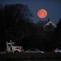 BOSTON, MA - March 20, 2019: - Commuters on I-93 were treated to the moon sets over Dorchester neighborhood of Boston, MA on March 20, 2019. (The third supermoon of 2019 on Wednesday isnÕt just special because itÕs the last supermoon of the year. ItÕs also the first supermoon in nearly 20 years to fall near the spring equinox. The Òsuper worm equinox moon,Ó as itÕs known, follows JanuaryÕs Òsuper blood wolf moonÓ and FebruaryÕs Òsuper snow moon.Ó This supermoon will hit its peak at 9:43 p.m. Wednesday, almost four hours after the spring equinox officially hits. This is the first time the two have landed on the same day since March 2000, according to EarthSky.org. Those hoping to catch the supermoon should be in luck: The National Weather Service is predicting mostly clear skies across New England, with clouds increasing as the night goes on.)77(Craig F. Walker/Globe Staff) section: Metro reporter: 