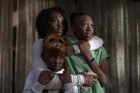 (Clockwise from top left) Lupita Nyong'o, Shahadi Wright Joseph, and Evan Alex in the film 