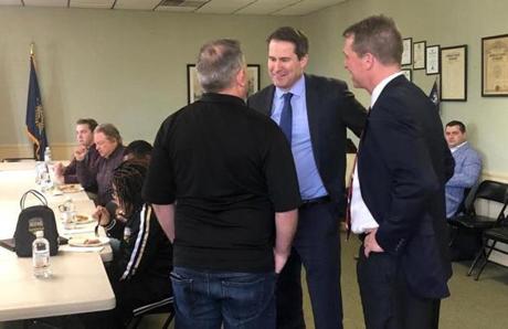 Representative Seth Moulton (center) spoke to a veteran at a roundtable in Columbia, S.C.
