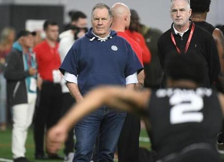 New England Patriot coach Bill Belichick, center, watches Jayson Stanley run a football drill during Georgia Pro Day, Wednesday, March 20, 2019, in Athens, Ga. (AP Photo/John Amis)

