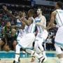 Boston Celtics forward Marcus Morris, left, is swarmed by the Charlotte Hornets defense in the first half of an NBA basketball game Saturday, March 23, 2019, in Charlotte, N.C. (AP Photo/Jason E. Miczek)