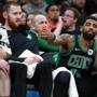 3-24-19: Boston, MA: Gordon Hayward (left) and Aron Baynes (center) returned to the lineup for the Celtics tonight, but by the time the last minutes of the game were being contested on the floor, they, along with Kyrie Irving (right) were on the bench as the subs finished up the San Antonio blowout victory. Iriving has taken off the wrap he was wearing on his left hand and tosses it aside with his right, knowing he wil not be re entering the game. The Boston Celtics hosted the San Antonio Spurs in a regular season NBA basketball game at the TD Garden. (Jim Davis /Globe Staff).