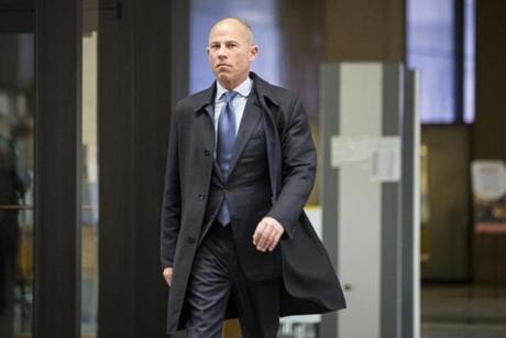 Attorney Michael Avenatti, who is representing an alleged victim of R. Kelly, walks into the Leighton Criminal Courthouse for R. Kelly's first hearing since the R&B star was charged with sexually abusing four people, including three minors, years ago, Saturday, Feb. 23, 2019 in Chicago. Cook County Judge John Fitzgerald Lyke Jr. has set Kelly?s bond at $1 million saying that the amount equals $250,000 for each of the four people he?s charged with sexually abusing. (Ashlee Rezin/Chicago Sun-Times via AP)
