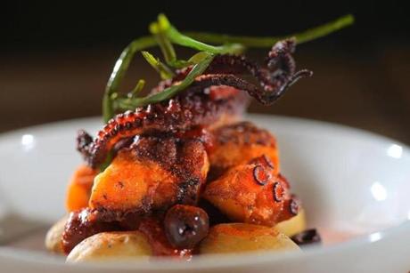 Octopus with potatoes, olives, and dollops of harissa
