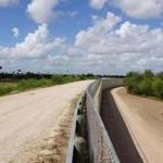 (FILES) In this file photo taken on June 14, 2018 a wall along one of the several layers of the US-Mexico border fencing is seen in the border town of McAllen, Texas. - Acting Pentagon chief Patrick Shanahan has authorized $1 billion to build part of the wall sought by Donald Trump along the US-Mexico border, the first funds designated for the project under the president's emergency declaration. The Department of Homeland Security asked the Pentagon to build 57 miles (92 kilometers) of 18-foot (5.5-meter) fencing, construct and improve roads, and install lighting to support Trump's emergency declaration. Shanahan 
