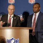 Rich McKay, Atlanta Falcons CEO and chairman of the NFL Competition Committee, left, and Troy Vincent, the NFL's executive vice-president of football operations, speak to reporters at the NFL fall meetings in New York, Tuesday, Oct. 16, 2018. (AP Photo/Seth Wenig)