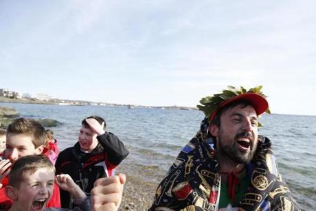 Gloucester, MA, 03/27/2019 -- Jamie McDonald aka Adventureman cheered after completing the final leg of his 5,500 mile cross-country run, the equivalent of 210 marathons. (Jessica Rinaldi/Globe Staff) Topic: 27runner Reporter: Billy Baker
