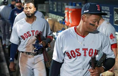 3-28-19: Seattle, WA: The Red Sox Eduardo Nunez (left) and Rafael Devers (right) head out of the dugout and towards the clubhouse following the final out of Boston's 12-4 loss. The Boston Red Sox visited the Seattle Mariners for their Opening Day MLB baseball game at T-Mobile Park. (Jim Davis /Globe Staff).
