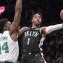Brooklyn Nets guard D'Angelo Russell (1) goes to the basket against Boston Celtics center Robert Williams III (44) during the first half of an NBA basketball game, Saturday, March 30, 2019, in New York. (AP Photo/Mary Altaffer)
