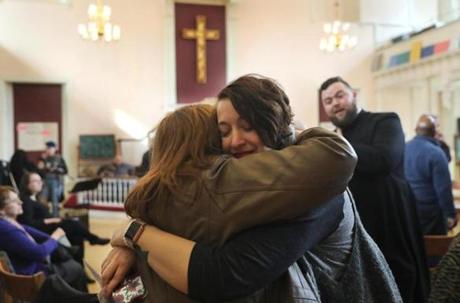 Chaplain Alexx Wood (left), from Bedford, embraced the Rev. Randi Rocco, from Sanbornville, N.H., last Sunday at Old West Church.
