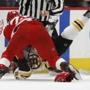 Boston Bruins center Noel Acciari is taken down by Detroit Red Wings right wing Luke Witkowski (28) as they fight during the second period of an NHL hockey game, Sunday, March 31, 2019, in Detroit. (AP Photo/Carlos Osorio)