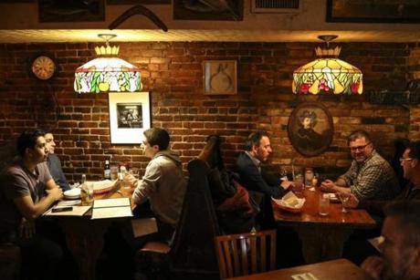 Boston, MA--03/28/2019--Customers eat and drink in the cozy booths near the back of Anchovies in the South End on Thursday evening. (Nathan Klima for The Boston Globe) Topic: 03whatsheshaving Reporter:
