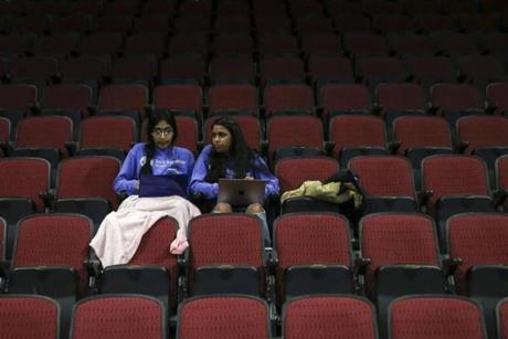 Boston, MA--03/22/2019--Mansi Gera (left) and Rhea Verma work in a seating section of the Agganis Arena during the TechTogether hackathon on Saturday afternoon. (Nathan Klima for The Boston Globe) Topic: 26techtogether Reporter:
