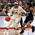TAMPA, FLORIDA - APRIL 05: Arike Ogunbowale #24 of the Notre Dame Fighting Irish is defended by Crystal Dangerfield #5 of the UConn Huskies during the second quarter in the semifinals of the 2019 NCAA Women's Final Four at Amalie Arena on April 05, 2019 in Tampa, Florida. (Photo by Mike Ehrmann/Getty Images)