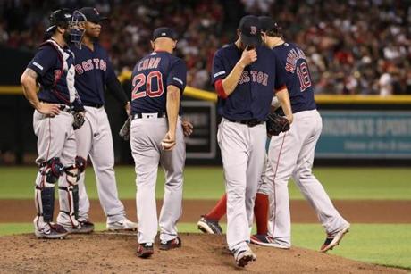 PHOENIX, ARIZONA - APRIL 05: Starting pitcher Rick Porcello #22 of the Boston Red Sox is removed by manager Alex Cora #20 during the fifth inning of the MLB game against the Arizona Diamondbacks at Chase Field on April 05, 2019 in Phoenix, Arizona. (Photo by Christian Petersen/Getty Images)
